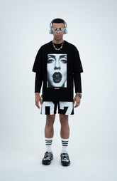 Model in the Haresquare black t-shirt with a bold graphic print, styled with Haresquare Shorts in black & Luxury sunglasses – unisex luxury streetwear from Ireland.