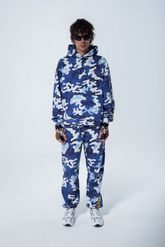 Model in the Haresquare Pink Camouflage Tracksuit with an Orange print – unisex luxury streetwear from Ireland.