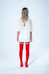 Model in the Haresquare vintage white tshirt with F*CK SOCIETY graphic print in red, styled with Haresquare mini skirt and designer boots – unisex luxury streetwear from Ireland.