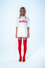 Model in the Haresquare vintage white tshirt with F*CK SOCIETY graphic print in red, styled with Haresquare mini skirt and designer boots – unisex luxury streetwear from Ireland.