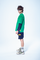 Model in the Haresquare Green tshirt with breathless bear graphic print, styled with Haresquare black shorts – unisex luxury streetwear from Ireland.
