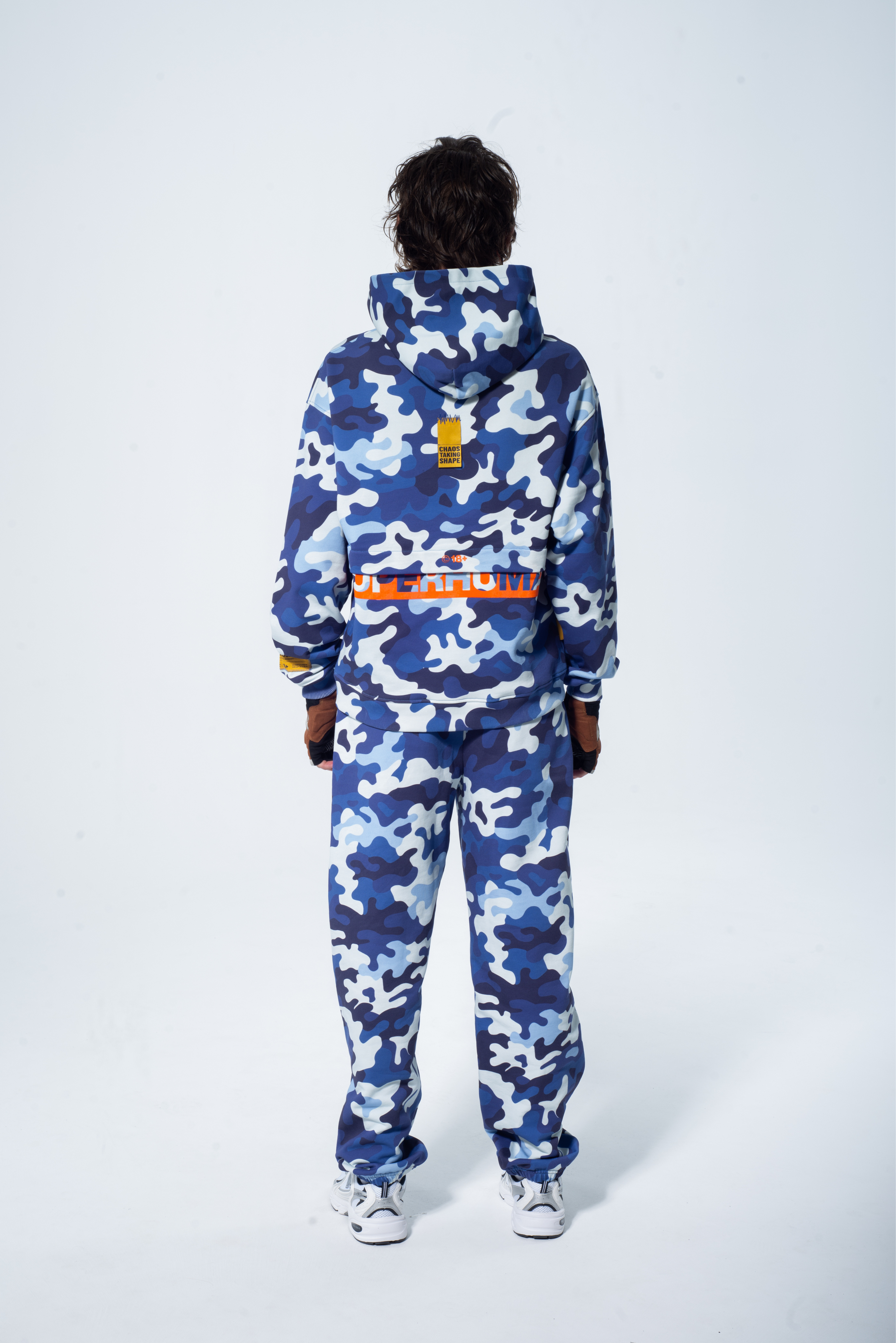 Model in the Haresquare Pink Camouflage Tracksuit with an Orange print – unisex luxury streetwear from Ireland.